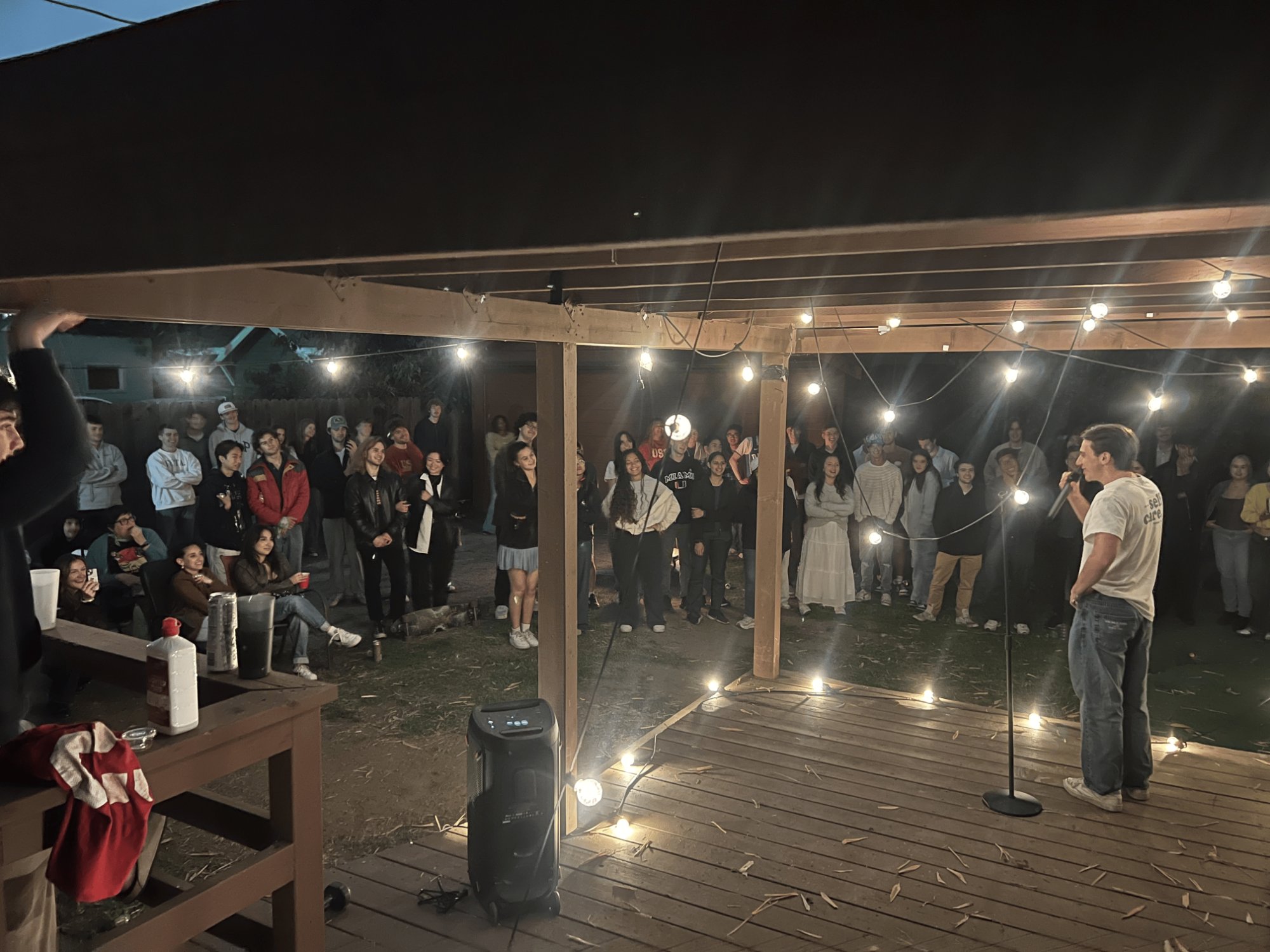 My Standup Comedy 2 (THTR-482) USC Midterm Performance (in the picture, my classmase Charlie Corbin is performing), at a house north of the USC campus, March 2025