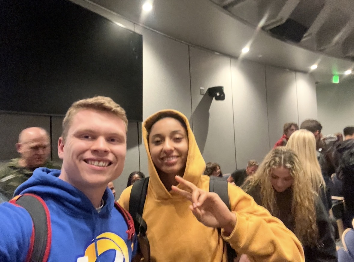 Me in my blue LA Rams hoodie sitting next to JuJu Watkins